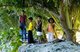 Maldives: Children on top of the man-made soil wall built for the protection of the local houses, Feydhoo Island, Addu Atoll (Seenu Atoll)