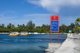 Maldives: Dive boats and 'Welcome to Gan' sign, Gan Island, Addu Atoll (Seenu Atoll)
